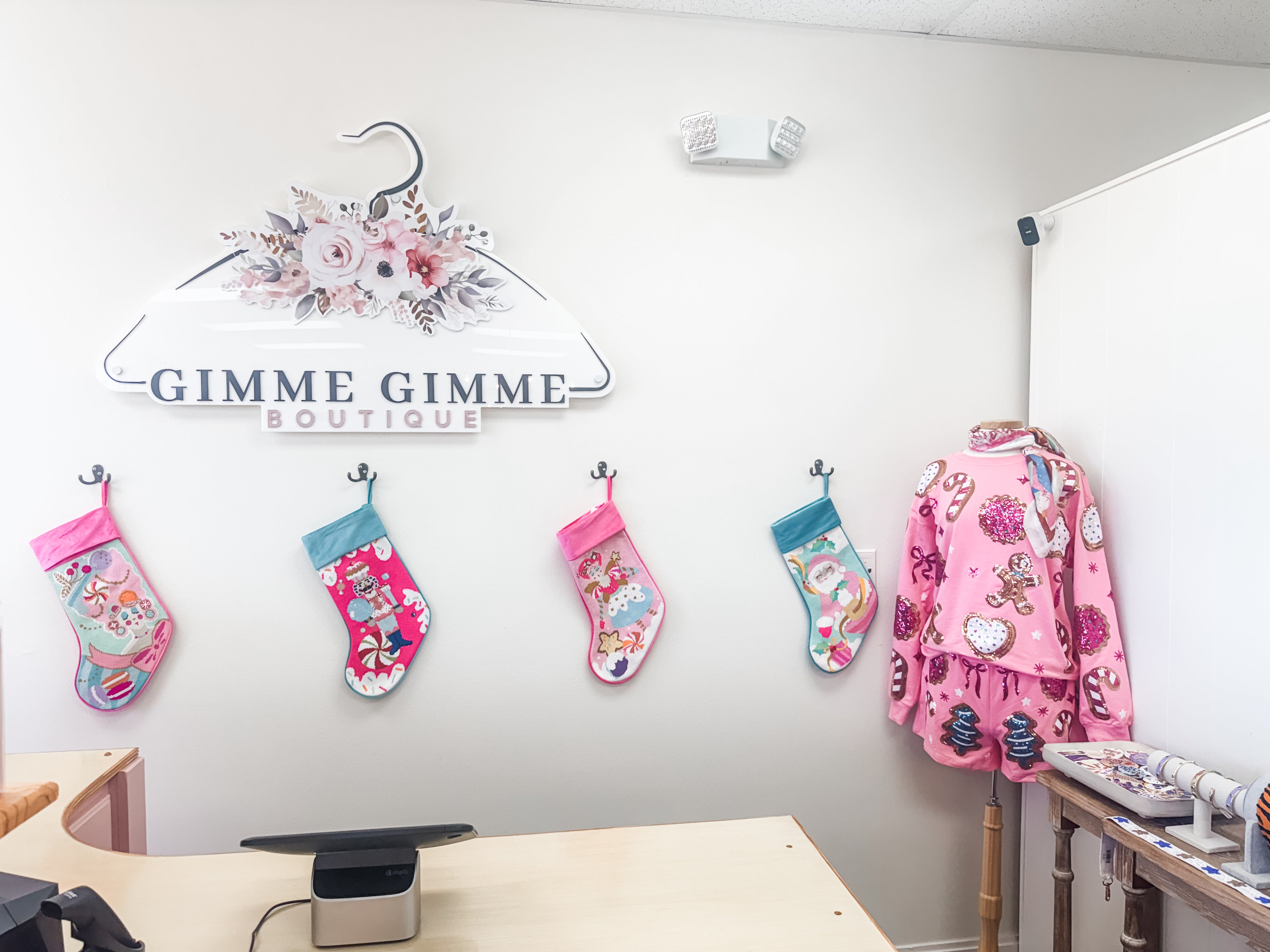 womens clothing boutique checkout counter at christmas